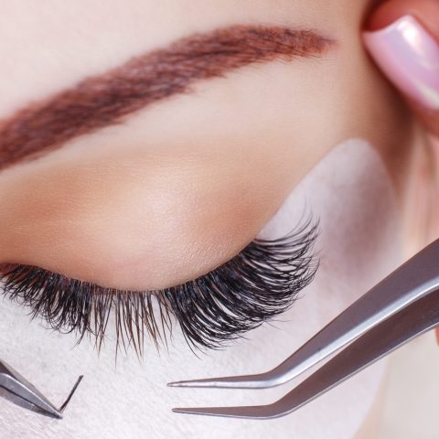 Eyelash Extension Procedure. Woman Eye with Long Eyelashes. Lashes, close up, macro, selective focus